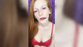 redhead beauty smokes a pink cigarette, purple makeup