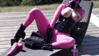 Cristal Kinky in pink latex catsuit and pink rubber gasmask playing with pink Hankeys Toy solo Preview