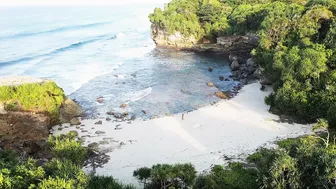 Putri Cinta stripping on a beautiful tropical beach