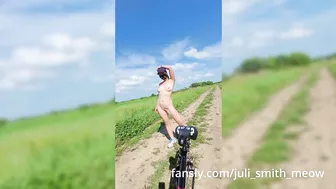 A girl rides a bike completely naked!