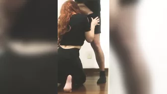 Redhead sucking cock on her knees until he came in her face.