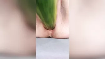 Ftm masturbates hairless noisy pussy with a cucumber close up.