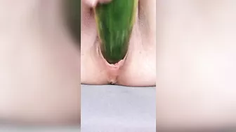 Ftm masturbates hairless noisy pussy with a cucumber close up.