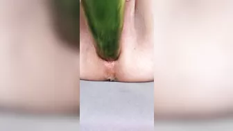 Ftm masturbates hairless noisy pussy with a cucumber close up.