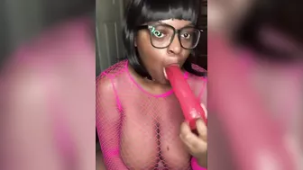 Nerdy Busty Ebony Babe Sucking on a Dildo