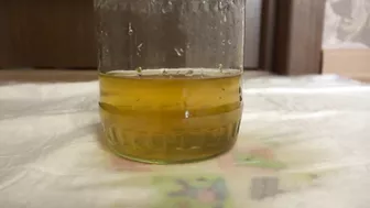 Pissing. Mature, hairy big pussy pissing in a jar. Would you like that drink with yellow urine? ASMR. Dirty fetish.