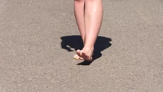 Bare feet on hot asphalt