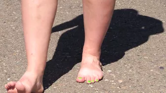 Bare feet on hot asphalt