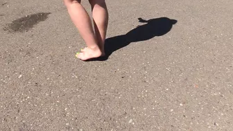 Bare feet on hot asphalt