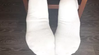 STUDENT GIRL SHOWS WHITE SOCKS AND FEET AFTER STUDYING.