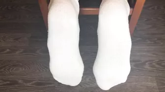 STUDENT GIRL SHOWS WHITE SOCKS AND FEET AFTER STUDYING.