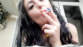 Dominatrix Nika smokes a cigarette and blows smoke in your face. Smoking fetish. The fetish of cigarette smoke.