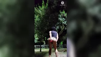 Sissy crossdresser in slutty dress dildoing her ass in public park at night