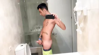 Quick hotel bathroom cumshot into sink in swim trunks while friend is gone