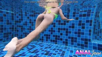 Asian Girl Swims with Big Butt Plug