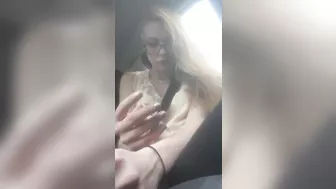 Beautiful junkie doing a shot in the car