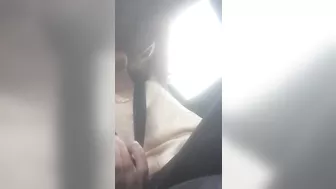 Beautiful junkie doing a shot in the car