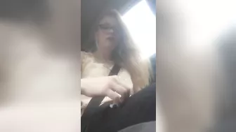 Beautiful junkie doing a shot in the car