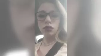 Beautiful junkie doing a shot in the car