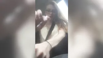 Beautiful junkie doing a shot in the car