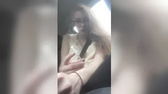 Beautiful junkie doing a shot in the car