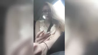 Beautiful junkie doing a shot in the car