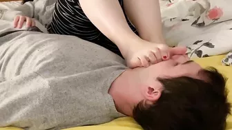 Girlfriend’s feet on my face in bed