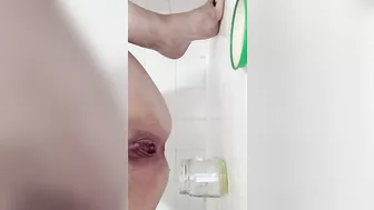 Milf pissing into jar