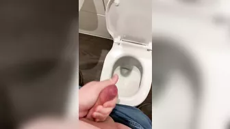 Wanking off in public cubicle with big cumshot at the end