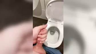 Wanking off in public cubicle with big cumshot at the end