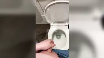 Wanking off in public cubicle with big cumshot at the end