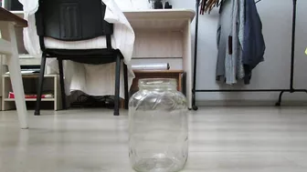 MILF peeing profusely in a jar