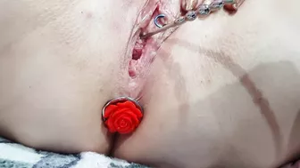 Sounding masturbation of a pierced pussy with an anal plug