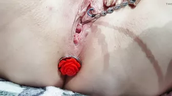 Sounding masturbation of a pierced pussy with an anal plug