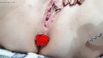 Sounding masturbation of a pierced pussy with an anal plug