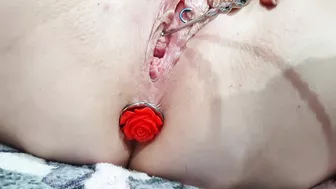 Sounding masturbation of a pierced pussy with an anal plug