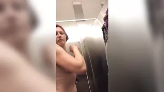 Topless flapping by mommy in the toilets at the airport