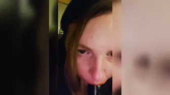 Sucking a big black dildo