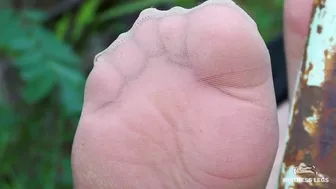 Sexy bare feet and nylon soles outdoor closeups