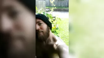 Bearded guy stroking outside