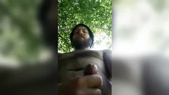 Bearded guy stroking outside