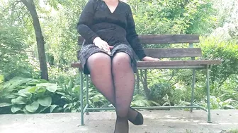 Naughty milf in pantyhose pissing in the park on a bench rear view