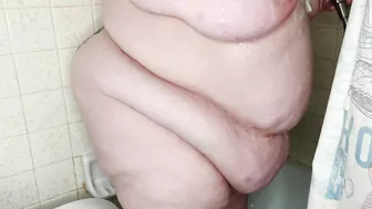 Watching my stepmother showing and masturbate with the shower head.