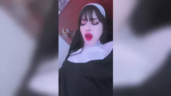 This horny nun plays with her pussy and a vibrator