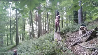 Standing pissing in a woods in a bunny mask and fishnet