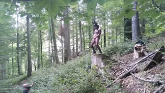 Standing pissing in a woods in a bunny mask and fishnet