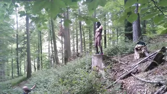 Standing pissing in a woods in a bunny mask and fishnet