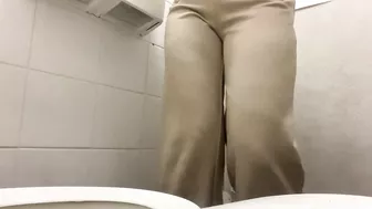 Girl Peeing at the work public toilet