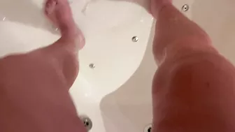 Girl using shower after wetting accident in shorts