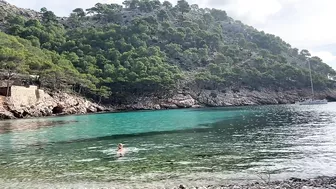 girl swimming on a public beach completely naked